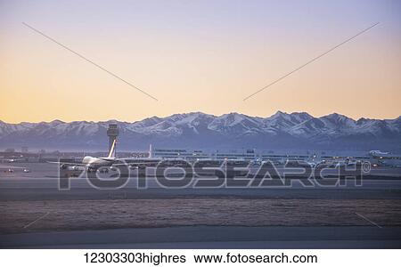 Stock Photograph - A 747 on the runway at the Ted Stevens Anchorage International Airport, Anchorage, Southcentral Alaska, USA, Spring. Fotosearch