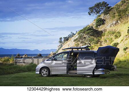 Stock Photograph - A beachfront campsite on the northernmost tip of the Coromandel Peninsula, Fletcher Bay; Waikato, New Zealand. Fotosearch