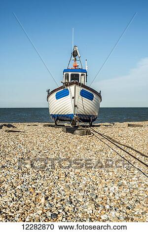 A boat on a shingle beach; Dungeness, Kent, England View Large Photo Image Stock Image - A boat on a shingle beach; Dungeness, Kent, England. Fotosearch
