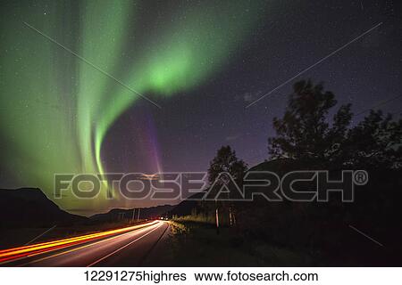 A car passes by on the Seward Highway south of Girdwood, Alaska, as the aurora borealis dance overhead. View Large Photo Image Stock Photograph - A car passes by on the Seward Highway south of Girdwood, Alaska, as the aurora borealis dance overhead.. Fotosearch