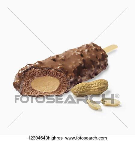 Stock Photograph - A chocolate covered ice cream treat filled with peanut butter on a white background; Toronto, Ontario, Canada. Fotosearch