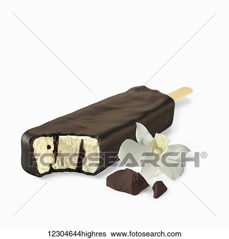 A chocolate covered ice cream treat filled with vanilla ice cream on a white background; Toronto, Ontario, Canada View Large Photo Image Stock Photograph - A chocolate covered ice cream treat filled with vanilla ice cream on a white background; Toronto, Ontario, Canada. Fotosearch