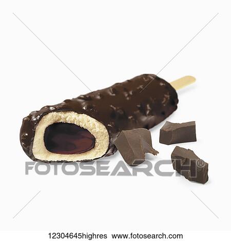 A chocolate covered ice cream treat filled with fudge on a white background; Toronto, Ontario, Canada View Large Photo Image Stock Photograph - A chocolate covered ice cream treat filled with fudge on a white background; Toronto, Ontario, Canada. Fotosearch