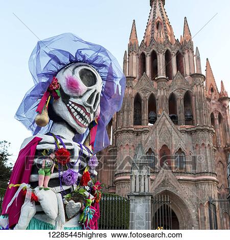 A colourful costume with skull mask in front of a church building; San Miguel de Allende, Guanajuato, Mexico View Large Photo Image Stock Photograph - A colourful costume with skull mask in front of a church building; San Miguel de Allende, Guanajuato, Mexico. Fotosearch