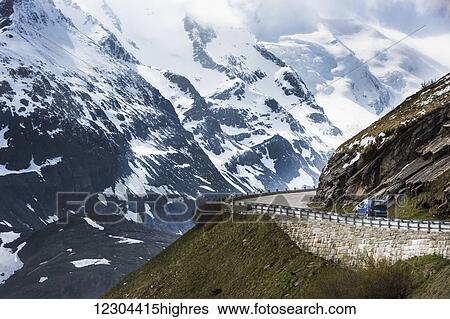 Stock Photograph - A drive headed to the summit of Austria's highest mountain pass, the Grossglockner High Alpine Road; Untertauern, Karnten, Austria. Fotosearch