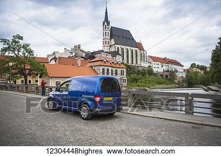 Stock Photograph - A drive through the town centre of Cesky Krumlov, a beautiful little medieval city in the South Bohemian region of Czech Republic; Cesky Krumlov, Czech Republic. Fotosearch