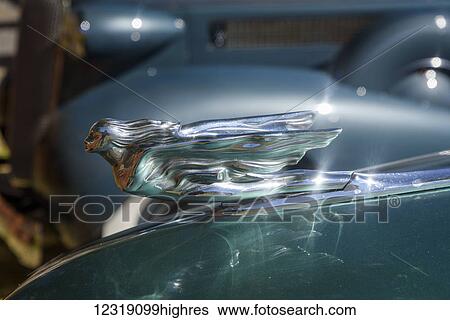 A hood ornament reflects on the hood of a classic car; Frenchglen, Oregon, United States of America View Large Photo Image Stock Photograph - A hood ornament reflects on the hood of a classic car; Frenchglen, Oregon, United States of America. Fotosearch