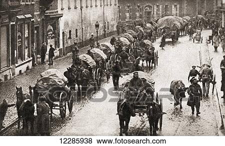 A line of wagons and broken German troops march through Belgium in their retreat at the end of World War One. From The Pageant of the Century, published 1934 View Large Photo Image Stock Photo - A line of wagons and broken German troops march through Belgium in their retreat at the end of World War One. From The Pageant of the Century, published 1934. Fotosearch
