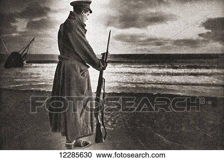 Stock Image - A lonely sentinel guards the East coast shores during WWI. From The Pageant of the Century, published 1934. Fotosearch