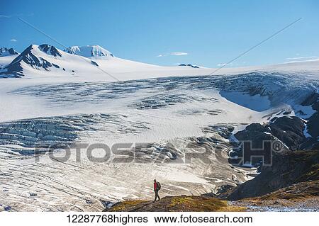 A man hiking near the Harding Ice Field Trail in Kenai Fjords National Park on the Kenai Peninsula in South Central Alaska View Large Photo Image Stock Photograph - A man hiking near the Harding Ice Field Trail in Kenai Fjords National Park on the Kenai Peninsula in South Central Alaska. Fotosearch