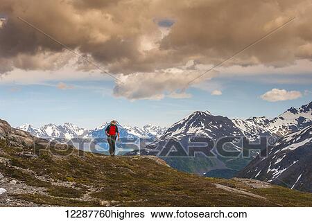 A man hiking near the Harding Icefield Trail with the Chugach Mountains and the Resurrection Valley in the background, Kenai Fjords National Park, Southcentral Alaska View Large Photo Image Stock Photograph - A man hiking near the Harding Icefield Trail with the Chugach Mountains and the Resurrection Valley in the background, Kenai Fjords National Park, Southcentral Alaska. Fotosearch