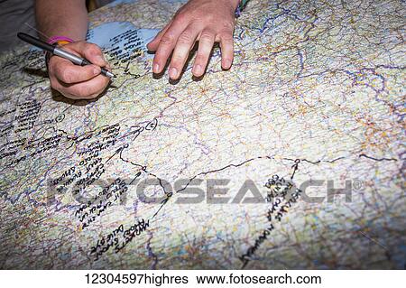 A man traces his European trip on a map; Bled, Slovenia View Large Photo Image Stock Photograph - A man traces his European trip on a map; Bled, Slovenia. Fotosearch