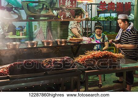 A Muslim Family Preparing Some Mutton In Their Traditional Barbecue Shop; Xian, Shaanxi Province, China View Large Photo Image Stock Photograph - A Muslim Family Preparing Some Mutton In Their Traditional Barbecue Shop; Xian, Shaanxi Province, China. Fotosearch