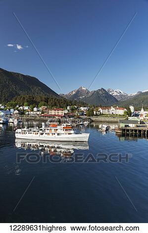 A passenger ship departs from Sitka Harbor with Sitka and the Three Sisters mountains in the background, Southeast Alaska, USA, Summer View Large Photo Image Stock Photograph - A passenger ship departs from Sitka Harbor with Sitka and the Three Sisters mountains in the background, Southeast Alaska, USA, Summer. Fotosearch