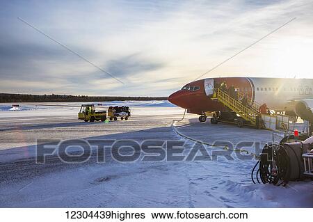 A plane lands at Kiruna airport during winter; Kiruna, Sweden View Large Photo Image Stock Photograph - A plane lands at Kiruna airport during winter; Kiruna, Sweden. Fotosearch