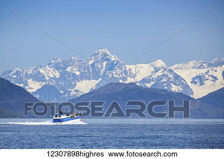 A small fishing boat on the waters of Main Bay, with the Chugach Mountains in the background, Prince William Sound, Whittier, Southcentral Alaska, USA View Large Photo Image Stock Photograph - A small fishing boat on the waters of Main Bay, with the Chugach Mountains in the background, Prince William Sound, Whittier, Southcentral Alaska, USA. Fotosearch