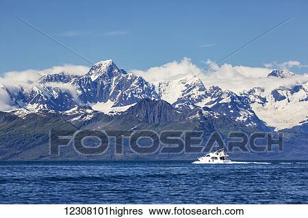 A small private boat motors through the Passage Canal on a sunny day, Prince William Sound, Whittier, Southcentral Alaska, USA, Summer View Large Photo Image Stock Photograph - A small private boat motors through the Passage Canal on a sunny day, Prince William Sound, Whittier, Southcentral Alaska, USA, Summer. Fotosearch
