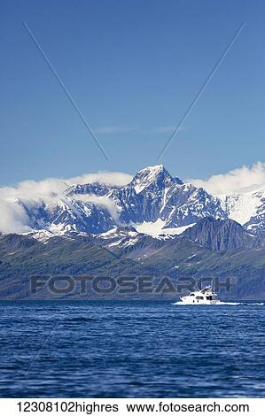 A small private boat motors through the Passage Canal on a sunny day, Prince William Sound, Whittier, Southcentral Alaska, USA, Summer View Large Photo Image Stock Photograph - A small private boat motors through the Passage Canal on a sunny day, Prince William Sound, Whittier, Southcentral Alaska, USA, Summer. Fotosearch