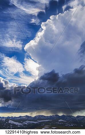 Stock Photograph - A summer rain storm towers over the Never Summer Mountains in Rocky Mountain National Park; Colorado, United States of America. Fotosearch