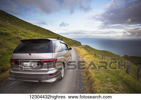 Stock Photograph - A sunset drive on a northern Coromandel beach of Port Jackson; Waikato, New Zealand. Fotosearch
