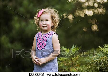 A three-year-old girl with curly hair at JC Raulston Arboretum; Raleigh, North Carolina, USA View Large Photo Image Stock Photography - A three-year-old girl with curly hair at JC Raulston Arboretum; Raleigh, North Carolina, USA. Fotosearch