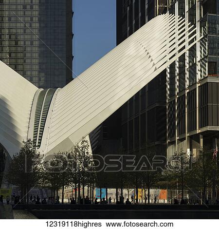 Stock Photograph - A unique structure of two white wings between skyscrapers; New York City, New York, United States of America. Fotosearch