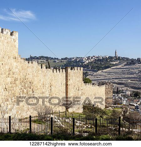 Stock Photograph - A wall with a view East, Mount of Olives; Jerusalem, Israel. Fotosearch