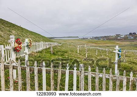 A weathered picket fence surrounds the grave crosses in the cemetary outside St. Paul, St. Paul Island, Southwestern Alaska, USA, Summer View Large Photo Image Stock Image - A weathered picket fence surrounds the grave crosses in the cemetary outside St. Paul, St. Paul Island, Southwestern Alaska, USA, Summer. Fotosearch