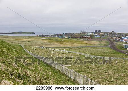 A weathered picket fence surrounds the grave crosses in the cemetary outside St. Paul, St. Paul Island, Southwestern Alaska, USA, Summer View Large Photo Image Stock Photograph - A weathered picket fence surrounds the grave crosses in the cemetary outside St. Paul, St. Paul Island, Southwestern Alaska, USA, Summer. Fotosearch