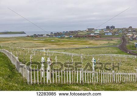 A weathered picket fence surrounds the grave crosses in the cemetary outside St. Paul, St. Paul Island, Southwestern Alaska, USA, Summer View Large Photo Image Stock Photography - A weathered picket fence surrounds the grave crosses in the cemetary outside St. Paul, St. Paul Island, Southwestern Alaska, USA, Summer. Fotosearch