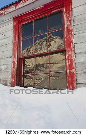 A weathered window reflects part of the old abandoned Independence Mine in Hatcher Pass in Southcentral Alaska in Winter. View Large Photo Image Stock Photograph - A weathered window reflects part of the old abandoned Independence Mine in Hatcher Pass in Southcentral Alaska in Winter.. Fotosearch