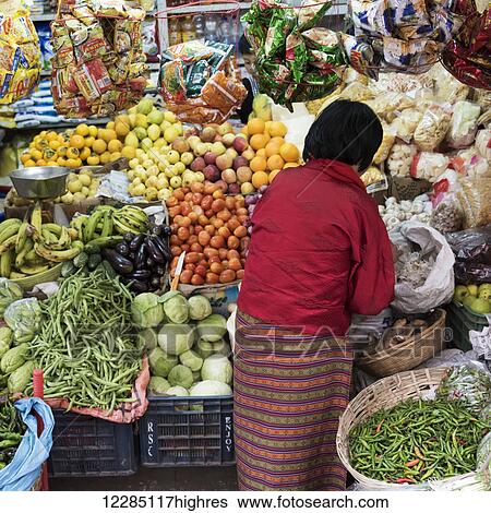 A woman shopping for fresh produce; Thimphu, Bhutan View Large Photo Image Stock Photograph - A woman shopping for fresh produce; Thimphu, Bhutan. Fotosearch