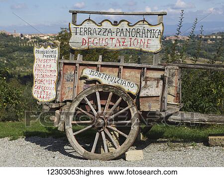 A wooden cart with numerous signs in Italian; Gaiole in Chianti, Toscana, Italy View Large Photo Image Stock Photograph - A wooden cart with numerous signs in Italian; Gaiole in Chianti, Toscana, Italy. Fotosearch