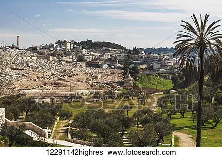 Stock Photograph - Absalom's tomb and graves in a cemetery; Jerusalem, Israel. Fotosearch