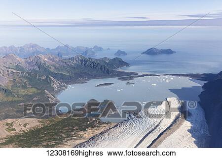 Stock Photograph - Aerial view of Bear Glacier and lagoon in summer, Resurrection Bay, Seward, Kenai Peninsula, Southcentral Alaska, USA. Fotosearch