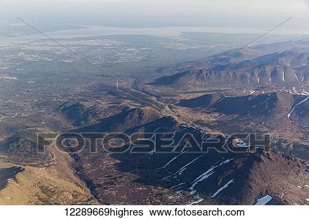 Stock Photograph - Aerial view of Flat Top Mountain and the Anchorage Bowl, Anchorage, Southcentral Alaska, USA, Summer. Fotosearch