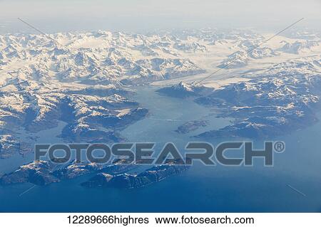 Aerial view of islands and snow capped peaks in Prince William Sound, Southeast Alaska, USA, Summer View Large Photo Image Stock Photograph - Aerial view of islands and snow capped peaks in Prince William Sound, Southeast Alaska, USA, Summer. Fotosearch