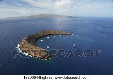 Aerial view of snorkelling and scuba boats, Molokini Island, between Kihei, Maui, and Kaho'olawe Island, National Hawaiian Humpback Whale Marine Sanctuary; Maui, Hawaii, United States of America View Large Photo Image Stock Photograph - Aerial view of snorkelling and scuba boats, Molokini Island, between Kihei, Maui, and Kaho'olawe Island, National Hawaiian Humpback Whale Marine Sanctuary; Maui, Hawaii, United States of America. Fotosearch
