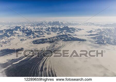 Aerial view of snow covered mountains and the Malaspina glacier in the Coastal Range, Southeast Alaska, USA, Summer View Large Photo Image Stock Photograph - Aerial view of snow covered mountains and the Malaspina glacier in the Coastal Range, Southeast Alaska, USA, Summer. Fotosearch