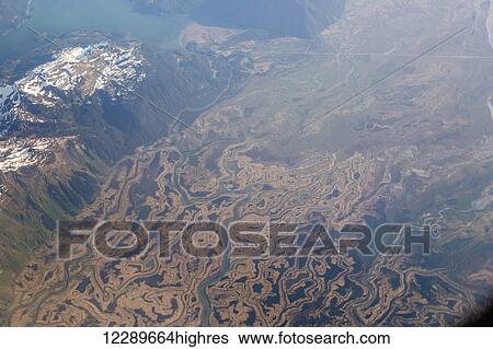 Stock Photograph - Aerial view of the Copper River Delta and Lake Eyak in the background, Cordova, Southeast Alaska, USA, Summer. Fotosearch