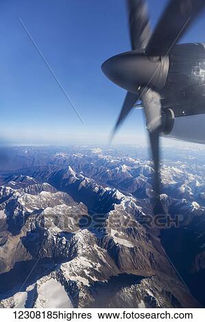 Stock Photograph - Aerial view of the Tordillo Mountains from a propeller commercial airplane, Southcentral Alaska, USA, summer. Fotosearch