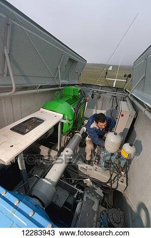 Alaska native technican checking for blade damage atop a wind turbine, St. Paul Island, Southwestern Alaska, USA, Summer View Large Photo Image Stock Image - Alaska native technican checking for blade damage atop a wind turbine, St. Paul Island, Southwestern Alaska, USA, Summer. Fotosearch
