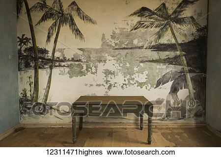 An old table in front of painted palm trees in an abandoned house; Elizabeth Bay, Namibia View Large Photo Image Stock Photograph - An old table in front of painted palm trees in an abandoned house; Elizabeth Bay, Namibia. Fotosearch