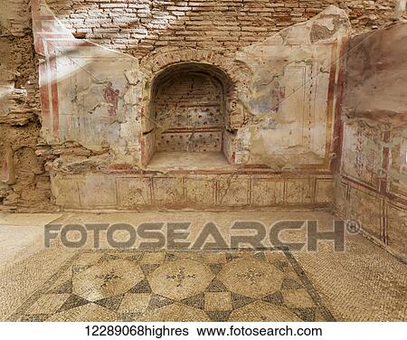 Stock Photograph - Ancient stone wall, decorative flooring and niche in a museum; Ephesus, Izmir, Turkey. Fotosearch