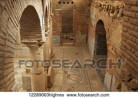 Stock Photograph - Ancient stone walls and artwork in a museum; Ephesus, Izmir, Turkey. Fotosearch