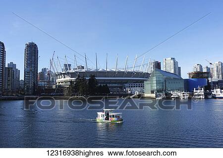 Stock Photograph - Aquabus passing BC Place; Vancouver, British Columbia, Canada. Fotosearch