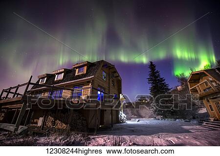 Aurora borealis over a home on the Anchorage hillside, Southcentral Alaska, USA View Large Photo Image Stock Photograph - Aurora borealis over a home on the Anchorage hillside, Southcentral Alaska, USA. Fotosearch