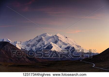 Stock Photograph - Autumn sunset on Denali as seen from the Stony Hill Overlook in Denali National Park, Interior Alaska, USA. Fotosearch
