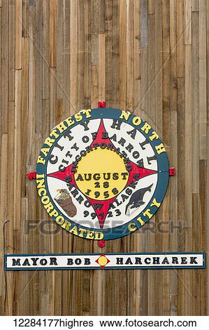 Stock Photograph - Badge on the wall marking the farthest north incorporated city, Barrow City Hall, Barrow, North Slope, Arctic Alaska, USA, Winter. Fotosearch