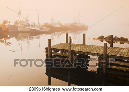 Stock Photograph - Bear Point Wharf on a foggy morning; Bear Point, Nova Scotia, Canada. Fotosearch